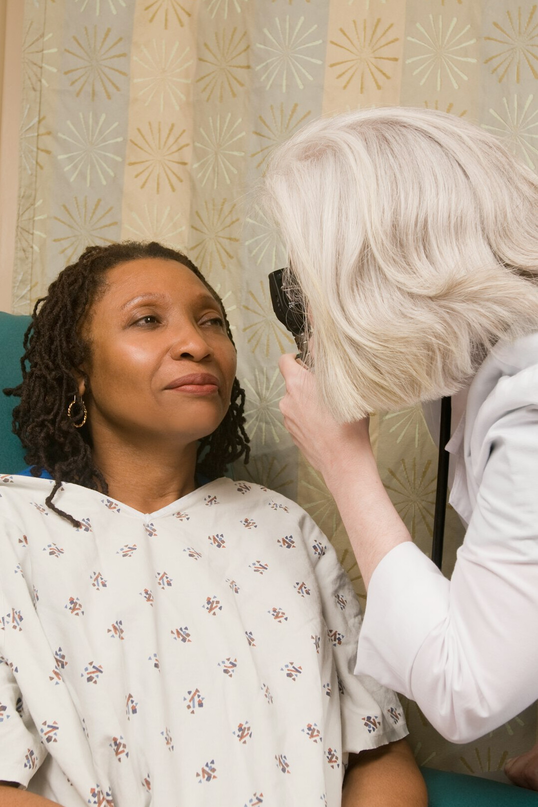 Latin American woman in her 40s talking with an adviser during a consultation
