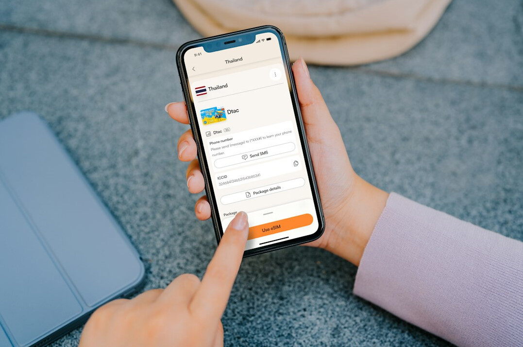 person checking bank app on phone